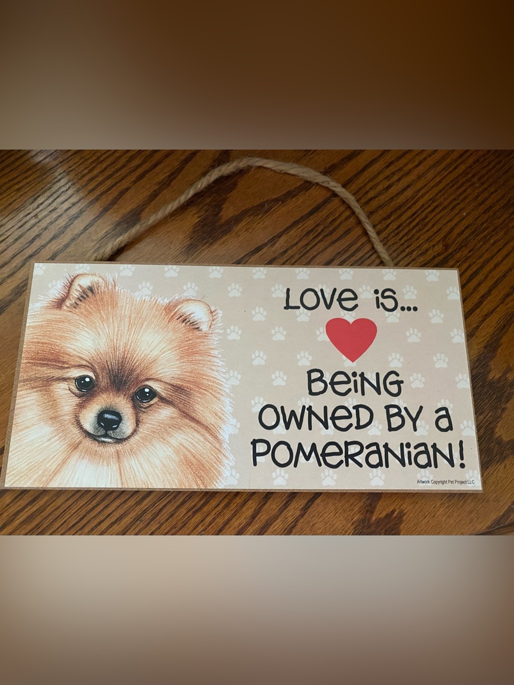 Love Is... Being Owned By a Pomeranian Decorative Wall Sign - Beige